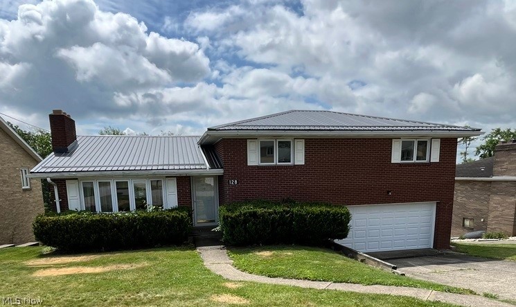 Updated 3 bedroom, 2 full bath, 1 half bath, brick, split level home in nice residential neighborhood in the village of Wintersville.    Finished room on lower level could be a 4th bedroom.  Finished rec room on lower level also.  Walk out basement to rear yard which is partially fenced.  Owner is having a new metal roof installed.