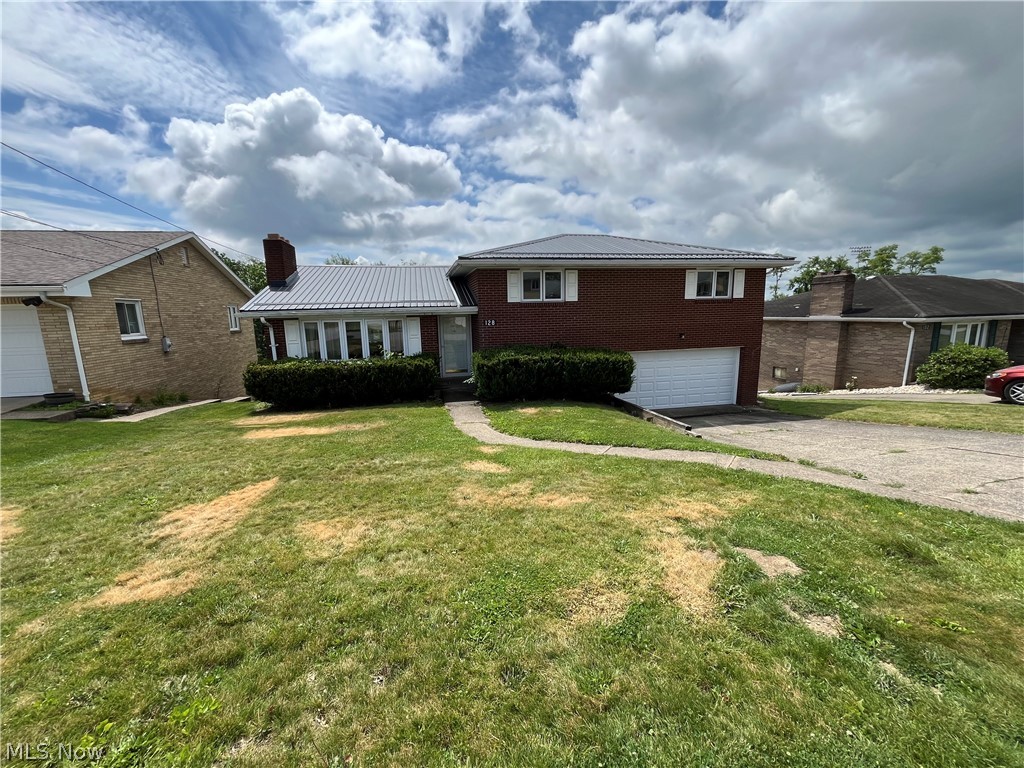 Updated 3 bedroom, 2 full bath, 1 half bath, brick, split level home in nice residential neighborhood in the village of Wintersville.    Finished room on lower level could be a 4th bedroom.  Finished rec room on lower level also.  Walk out basement to rear yard which is partially fenced.  Owner is having a new metal roof installed.