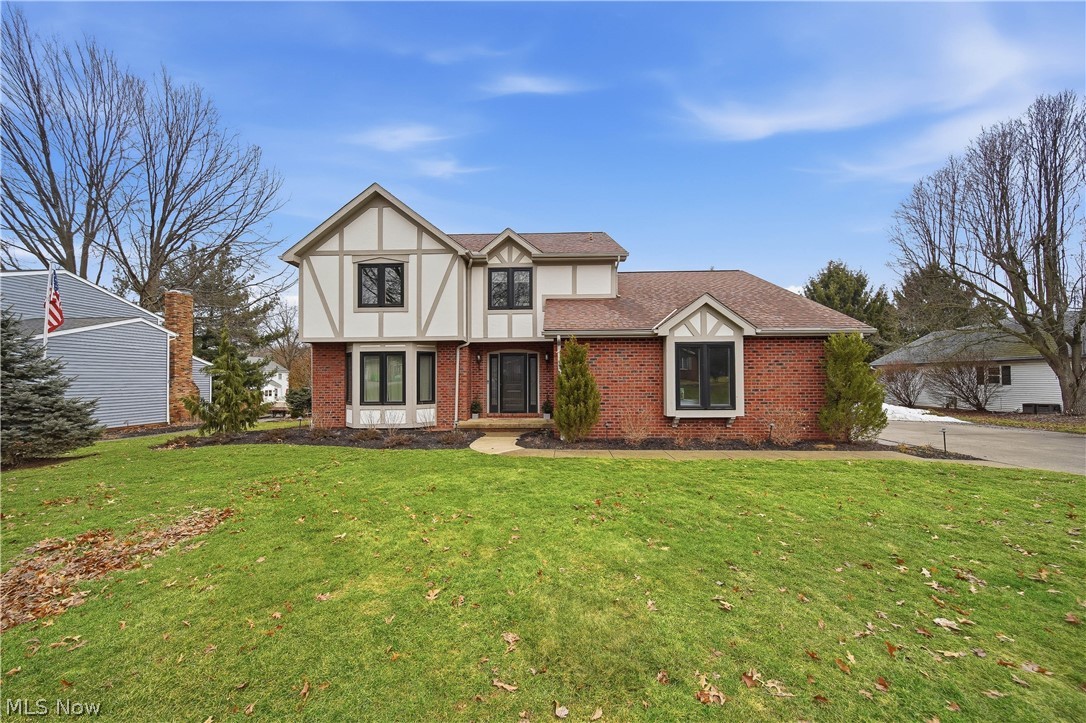 You could call this beautiful Tudor Style home yours! Conveniently located adjacent to the Prestwick County Club and Golf Course, while also offering easy access to I-77. Grand Extra-Wide solid Oak trims and moldings are found throughout the home, offering a richness hard to find in newer construction. The first floor offers plenty of open living space to enjoy with an additional Three Season room to relax and enjoy the view of the changing seasons. The large kitchen offers custom Oak cabinets and stainless steel appliances, as well as a large bay window that looks out over the deck, patio annd fenced backyard. The large first floor office could also be repurposed as a guestroom. Upstairs you will fall in love with Tall Vaulted ceilings throughout and skylight windows and both updated bathrooms. Enjoy large bedrooms with walk-in closets and a stunning updated Master Bedroom sure to please, measuring 20' x 16'! Updates include a new high efficiency furnace and water heater in 2016, central air unit 2010 and roof 2007. This established neighborhood in Green Local School District is just waiting to welcome you!