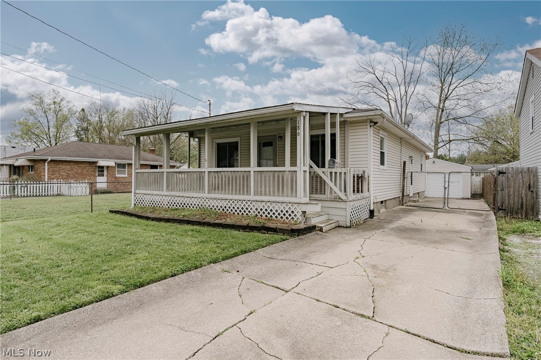 Welcome to 186 Pocantico – A Charming, Move-In Ready Ranch in Akron’s Desirable Ellet Neighborhood! This well-maintained home offers the perfect blend of comfort, style, and functionality, making it ideal for families and a smart opportunity for investors alike. From the moment you arrive, the inviting front porch sets the tone for the warm and welcoming feel throughout.

Step inside to an open-concept living room and kitchen, designed for everyday living and easy entertaining. The beautifully updated kitchen features stone countertops, modern cabinetry, a classic subway tile backsplash, stainless steel appliances, and durable tile flooring. A cozy eat-in area filled with natural light creates the perfect space for family meals, all flowing seamlessly into the spacious living room.

Down the hall, you’ll find three well-sized bedrooms, each with well-kept wood flooring, along with a completely renovated full bathroom that adds a fresh, modern touch to the main level.

The lower level expands your living space with multiple finished areas, including a bonus room set up like a bedroom, a generous rec room, a second full bathroom, and a dedicated laundry area—ideal for guests, extended living, or additional entertainment space.

Outside, enjoy a fully fenced-in backyard perfect for kids, pets, or relaxing gatherings. With its thoughtful updates, flexible layout, and move-in ready condition, this lovely home is ready to welcome its next chapter. Don’t miss out on this fantastic opportunity!