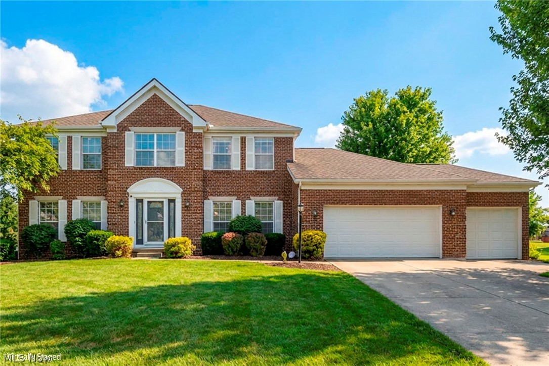Welcome to this stunning four-bedroom, 2.5-bath luxury home designed for both comfort and style. The spacious first floor features a convenient laundry room, private home office, and an inviting layout perfect for everyday living and entertaining. The heart of the home is the beautifully appointed kitchen with granite countertops, a large center island, and ceramic tile flooring, opening to a generous family room highlighted by a cozy gas fireplace with elegant ceramic tile surround. Just off the kitchen, the dining room provides the perfect setting for gatherings and special occasions. Upstairs, retreat to the expansive primary suite featuring vaulted ceilings and a luxurious private bath, creating a true owner's sanctuary. Three additional bedrooms offer brand-new carpet and stylish LVT flooring, along with a fully updated second-floor bath featuring new tile. The home also includes an oversized three-car garage providing ample space for vehicles, storage, or hobbies. A full unfinished basement offers endless possibilities ready for you to design the perfect recreation area, gym, or additional living space. This exceptional home blends modern updates, generous living spaces, and timeless design, making it the perfect place to call home. Hyde Park Dev in Green Local Schools. Roof 2023, HVAC 2021, HWT 2019