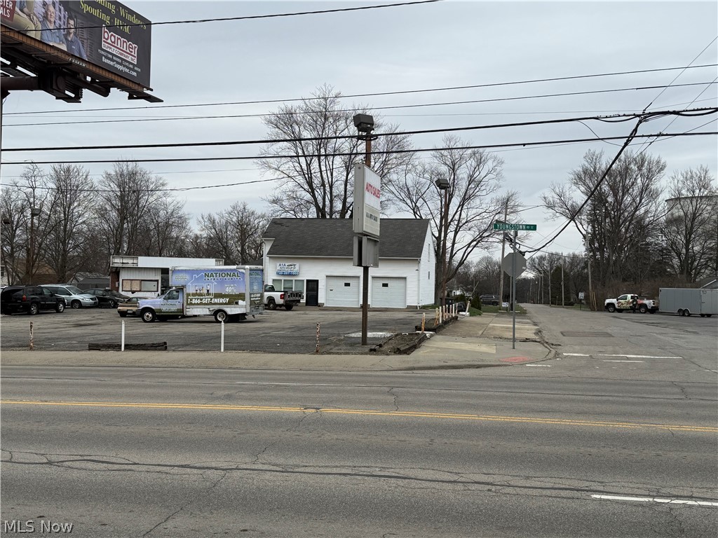 Seller Financing Available,  Commercial opportunity on this corner property. High traffic, high visibility. First floor reception/office area, garage/workshop area with 10' doors. Second floor is open space that can be used offices, storage.