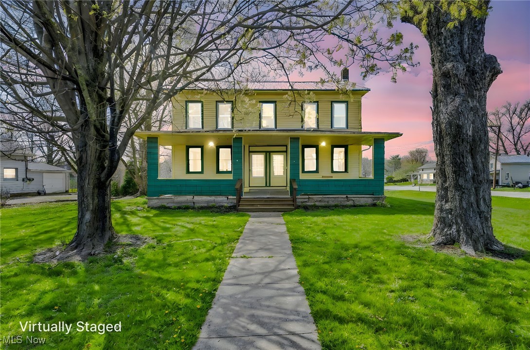 Welcome to this charming once 2 family home converted to a one single family home.  This home stunning home is filled with charm featuring 4 bedrooms, 2 bathrooms, 2 living rooms, 1 family room and a formal dining room along with 2 kitchens.  This home is ready for you to just move in and make your own.  Call for a showing today as this stunning home will not last!