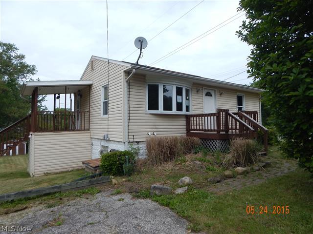 Great curb appeal on this ranch style home on over 1/2 acre lot with a walk-out basement, open floor plan with updated kitchen cabinets and stainless appliances, 2 bedrooms first floor and master bedroom and family room on lower level.  Equal Housing Opportunity.  Sells As Is.
