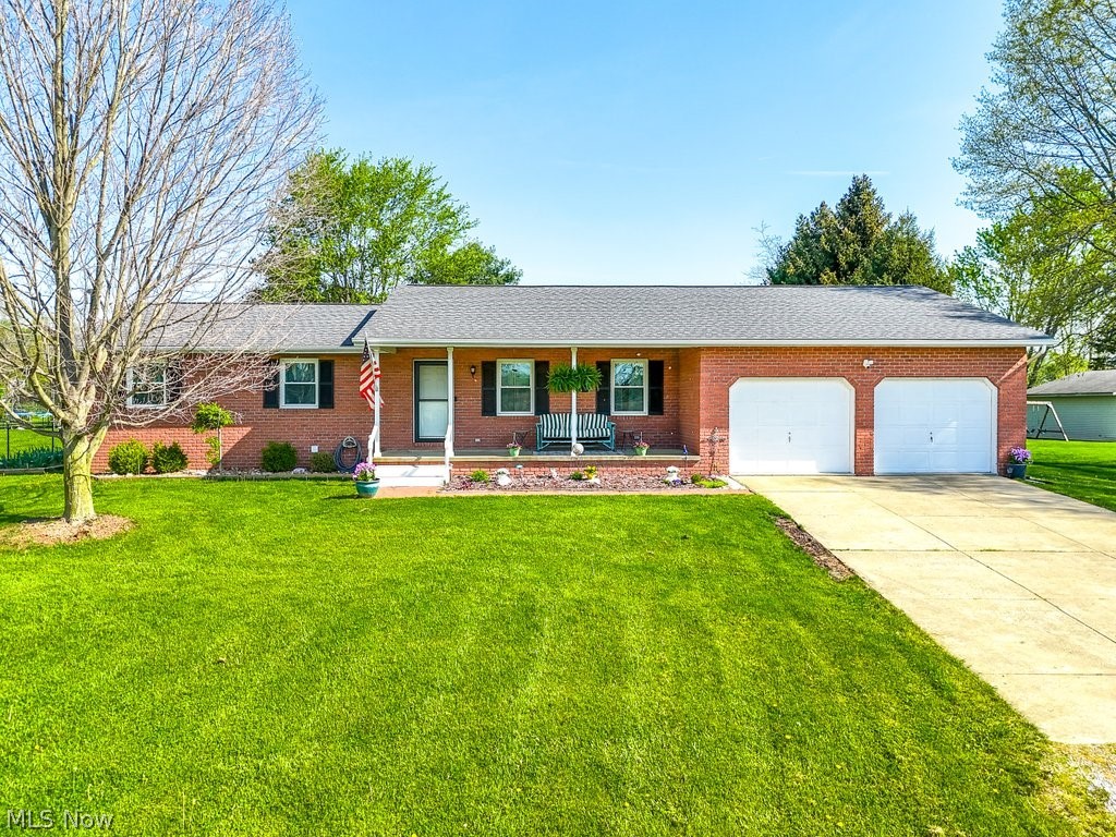 If you ever wanted the amenities of city life without city taxes, then this is the place for you. Introducing this meticulously maintained ranch-style home nestled in Wadsworth Township within the Wadsworth City School district. As you approach observe the lane leading to the property, situated back off of the road you'll be greeted by a charming front porch, ideal for enjoying your morning coffee and enjoying your spacious front yard. As you enter inside discover gorgeous laminate vinyl flooring throughout the main living space, including a large living room and a spacious eat-in kitchen boasting a quartz center island with gorgeous, leathered granite counters and custom Shrock wood cabinets, making this the perfect spot for entertaining. The main floor features three bedrooms and two recently updated full baths, complete with smart mirrors and fans. Descend to the lower level to find a fourth sizable bedroom, a full bath, and an office, along with a family room primed for hosting gatherings. Additional highlights include newer windows installed in 2023, a water filtration system, and an oversized deck with stairs leading to a personal fire pit area and a captain's pier into the distance. Privacy is ensured by a wood fence installed in 2022, while outdoor storage needs are met by a large shed installed the same year. This beautiful home is hardwired for internet and has two extenders. Don't miss you piece of paradise, call your realtor today to schedule a private showing.