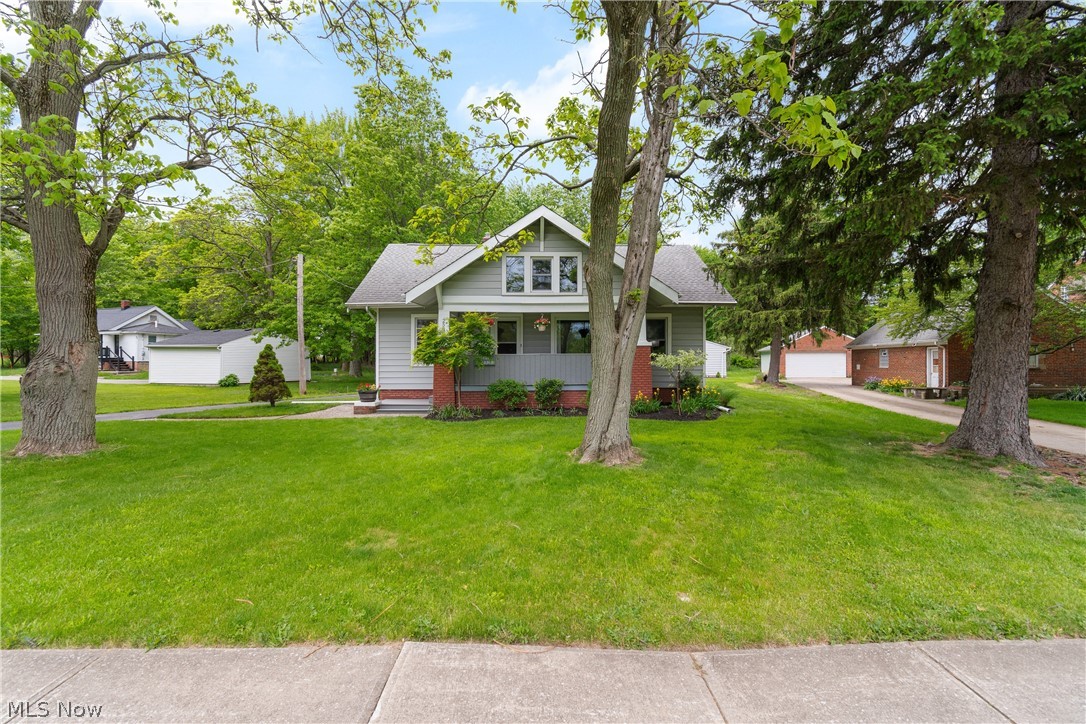 Welcome home to this meticulously maintained three-bedroom Cape Cod in Richmond Heights. The spacious living room showcases a new fireplace, updated flooring, soaring ceilings, and oversized windows overlooking the inviting enclosed front porch. The recently remodeled kitchen features newer cabinetry, granite countertops, subway tile backsplash, and stainless-steel appliances. Completing the main level is an updated full bathroom and a versatile first-floor bedroom, ideal as a guest room, home office, or walk-in closet.

Upstairs, you’ll find two additional bedrooms along with convenient access to attic storage. Car enthusiasts and hobbyists alike will appreciate the insulated 3.5-car garage, complete with two floor drains, newer garage doors, a 220 line with 50-amp service, oil-resistant polyurethane floor coating, and additional attic storage.

This well-cared-for home offers the perfect combination of charm, updates, and functionality in a desirable location.