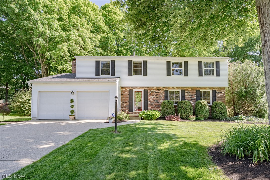 Welcome to 4680 Treetop Drive – Nestled in a quiet, highly desirable neighborhood, this spacious and well-maintained colonial offers the perfect blend of comfort, functionality, and timeless charm. From the moment you step through the front door, you'll be greeted by a welcoming foyer that flows effortlessly into the bright and inviting living room, creating an ideal space for everyday living and entertaining. The adjacent formal dining room provides the perfect setting for holiday gatherings, family dinners, and special occasions. The thoughtfully designed kitchen features hardwood flooring, ample cabinetry, a stylish tile backsplash, a full complement of appliances, and a convenient eat-in area for casual meals. Open to the kitchen, the spacious family room serves as the heart of the home, showcasing a cozy fireplace with elegant oak dentil molding and flat-panel wainscoting. A sliding glass door leads directly to the backyard, creating a seamless indoor-outdoor living experience. A convenient half bath completes the main level. Upstairs, you'll find four generously sized bedrooms and two full bathrooms, offering plenty of space for family and guests. The private primary suite features a spacious bedroom, a walk-in closet with the added convenience of laundry, and a private ensuite bath. The full basement expands the living space with a large finished recreation room, perfect for a media room, playroom, home gym, or game area, while still providing abundant storage and utility space. Step outside and enjoy your own private retreat. The expansive two-tier concrete patio offers plenty of room for outdoor dining, entertaining, and relaxing, while mature landscaping and foliage create a peaceful setting with exceptional privacy. With spacious living areas, a functional layout, and a sought-after Copley location, this wonderful home is ready for its next chapter. Don't miss the opportunity to make 4680 Treetop Drive your new home!