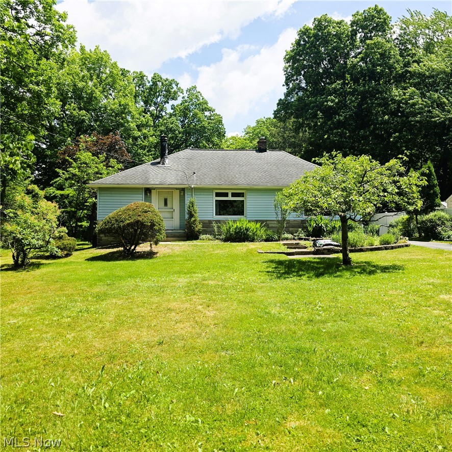 Very unique one of a kind four bedroom, two and a half bathroom Ranch with a three car garage abutting the Metroparks. Kitchen has see thru window to living room, tile countertop, pantry and all appliances stay. Dining room has big window looking outside to backyard and opening overlooking family room. Living room has fireplace, bay window and slider leading to a nice deck. Family room and fourth bedroom have a separate entrance perfect for in-law suite or nice home office set up. Nice backyard abuts the Metroparks with a three car garage with a pull thru garage and an outbuilding with a garage door for all your hobbies. Basement has bonus room with bathrooms, laundry room, glass block windows and loads of storage. Furnace 2023. Hot water tank 2022. Gutters, downspouts and refrigerator 2019. Roof 2010. Includes one year home warranty!