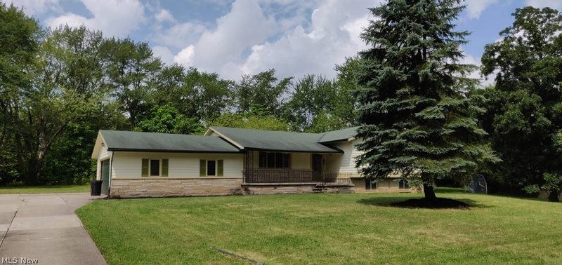 Tons of potential and space in this 3 bedroom split level!  It's like rural living in the middle of the suburb, large lot - over half an acre, 2 car attached garage, front porch, walk out basement and much more.  Come and make this your own today!  This is a Fannie Mae property
