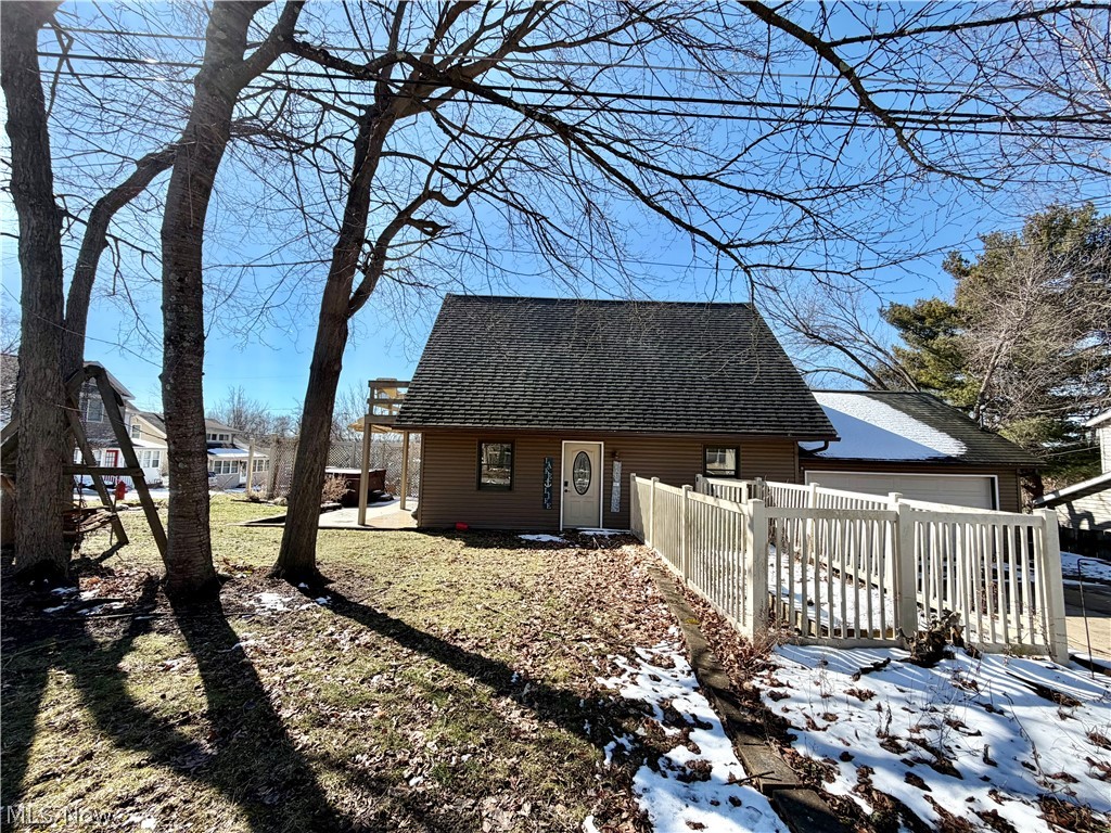 Welcome to this charming cap code in the heart of Chippewa Lake. The home features two bedrooms upstairs and a full bathroom on each floor. The stacked laundry is in the bathroom on the main level. You have a large living area, dining area, and kitchen on the main level as well. In the living room is a patio door that leads to the composite deck which features a motorized awning for shade and a hot tub. The primary bedroom also features its own private balcony with views of the Lake. The home sits on a corner lot which provides plenty of yard to relax and enjoy the summer days by the lake. This home is a perfect vacation home or rental.