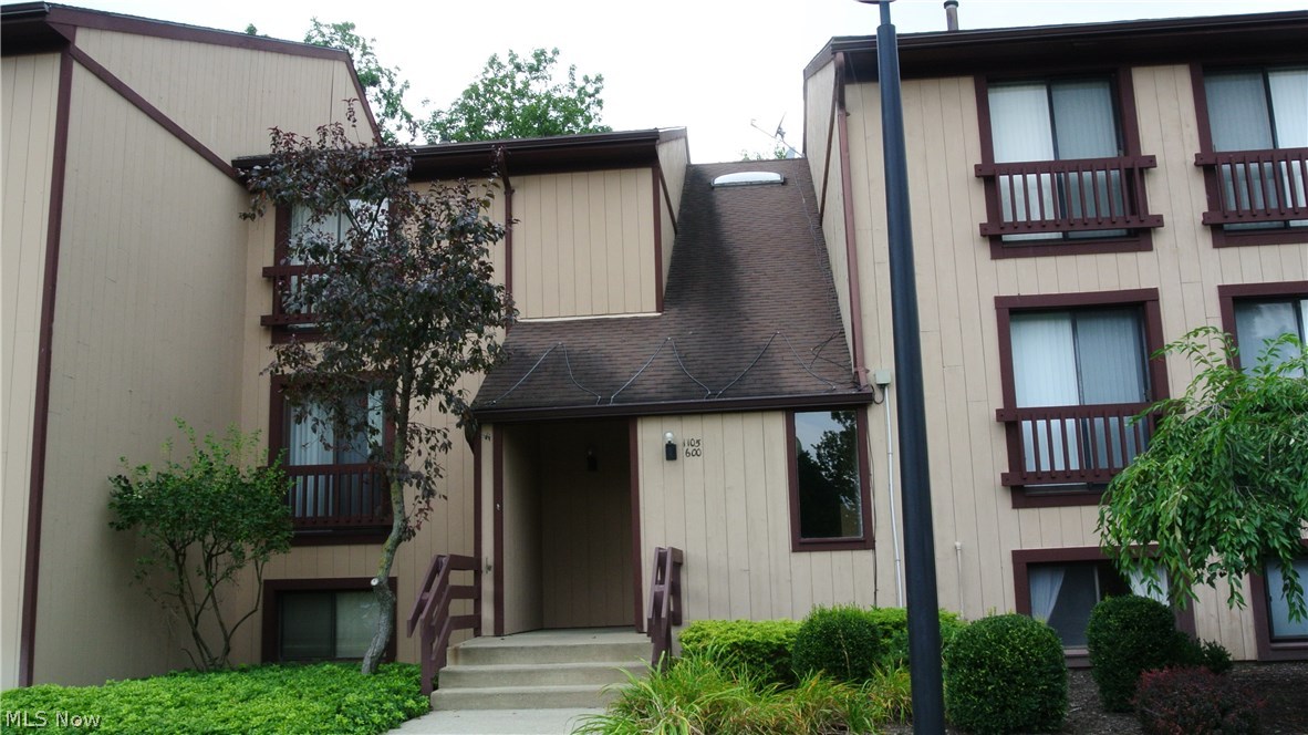 Nicely updated mid-level ranch condo with detached 1-car garage.  Replacement windows and sliders in 2008.  New furnace and air in 2011.  Remodeled kitchen with maple cabinets, newer counters, flooring, and sink.  Newer stove and never used dishwasher.  8 x 8 Covered balcony deck.  Walk-in entry closet.  First floor utility room.  Large bedroom with wall of closets.  Wooded view!  Enjoy all the amenities of desirable Greenwood Village.