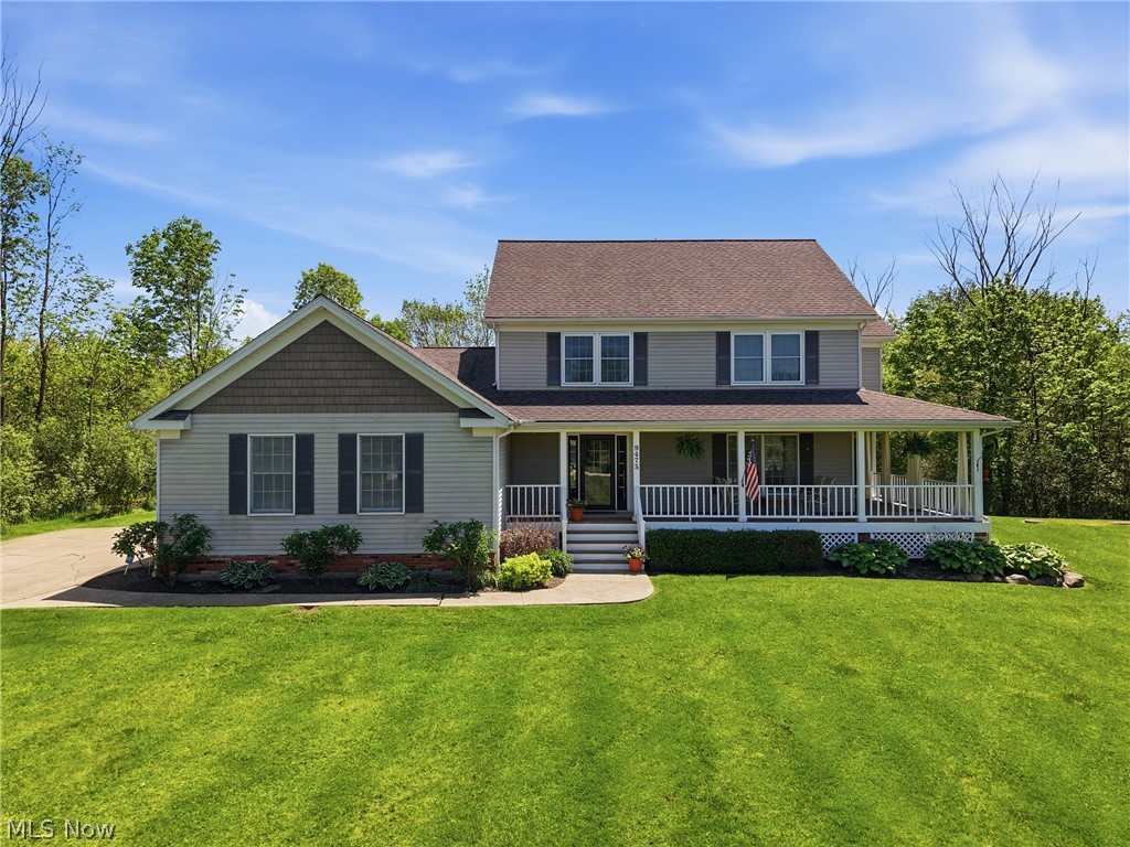 Discover this custom-built colonial set on 2.61 picturesque acres in Bainbridge Township. A sweeping wrap-a-round front porch welcomes you home and seamlessly connects to the dining room, creating a warm, inviting space for everyday living and memorable gatherings. Inside, there is a well appointed front living room, then the kitchen opens beautifully to the family room with a gas burning fireplace, offering an easy, natural flow. Two sliders step out to the expansive backyard, where a large trex deck with a retractable awning, overlooks the property. The laundry room and half bath complete the first floor amenities.  Upstairs, you’ll find a serene primary bedroom with an ensuite featuring double sinks, a soaking tub, separate shower, and dual closets. Three additional bedrooms share another full bath. Additionally, off of one of the upstairs bedrooms, there is a full walk-up attic with stair access, ideal for additional storage. The finished basement features a state-of-the-art custom theater room with premium lighting, projection screen, and leather motorized reclining seating. The theater is professionally sound-isolated and includes custom cabinetry, along with integrated Lutron lighting controls, creating a fully immersive entertainment experience.  See supplements for details.  The Generac whole home generator is an added bonus for your peace of mind. Lastly, there is storage galore in the 24 x 32 custom built outbuilding with a lean-to, cement floor, water and electric. This family estate is a rare blend of acreage, craftsmanship, and comfort, all within a short drive to downtown Chagrin Falls  and all that Geauga County has to offer!