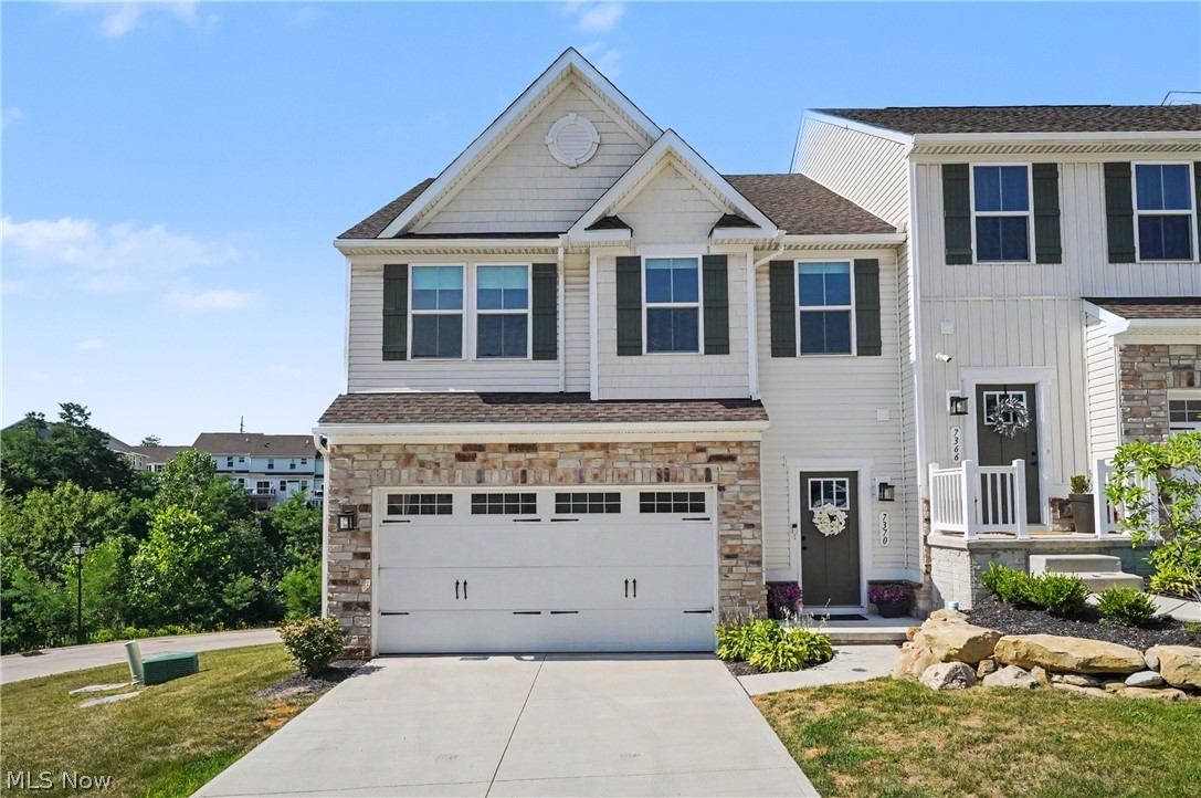 Welcome to luxury, low-maintenance living in one of Concord's newest communities! Built in 2024 and loaded with premium builder upgrades, this exceptional END-unit townhome offers the perfect blend of sophistication, comfort, and convenience. With rare additional green space, peaceful views of the creek and wooded backdrop, and a finished walkout bsmnt, this one-of-a-kind home stands apart from the rest. The thoughtfully designed open-concept main level is ideal for both everyday living and entertaining. Beautiful LVT flooring flows throughout the 1st floor, complemented by an upgraded lighting package that creates a bright, welcoming atmosphere. The expanded gourmet kitchen is the heart of the home, featuring granite countertops, a stylish tile backsplash, abundant cabinetry, a spacious breakfast island, and a gas range. Anchoring the space is a dramatic floor-to-ceiling stone electric fireplace, creating a stunning focal point and cozy gathering place. Just off the kitchen, the elevated deck provides the perfect spot to enjoy your morning coffee or unwind after a long day. Upstairs, you'll find a luxurious owner's retreat featuring an elegant tray ceiling, designer chandelier, two spacious walk-in closets, and a spa-inspired ensuite bath complete with dual vanities and a beautifully tiled Roman walk-in shower. Two add'l bedrooms, a 2nd full bath, and the convenience of a 2nd-floor laundry room complete the upper level. The finished walkout lower level provides exceptional flexibility with a spacious rec room plus a separate bonus room perfect for a home office, fitness studio, craft room, or playroom. Additional upgrades include professional paint throughout, a whole-home humidifier, and numerous builder enhancements that make this home truly move-in ready. Ideally located just minutes from Route 44, I-90, UH TriPoint, shopping, restaurants, parks, and everyday conveniences, this nearly new home delivers the perfect combination of luxury, location, and lifestyle.