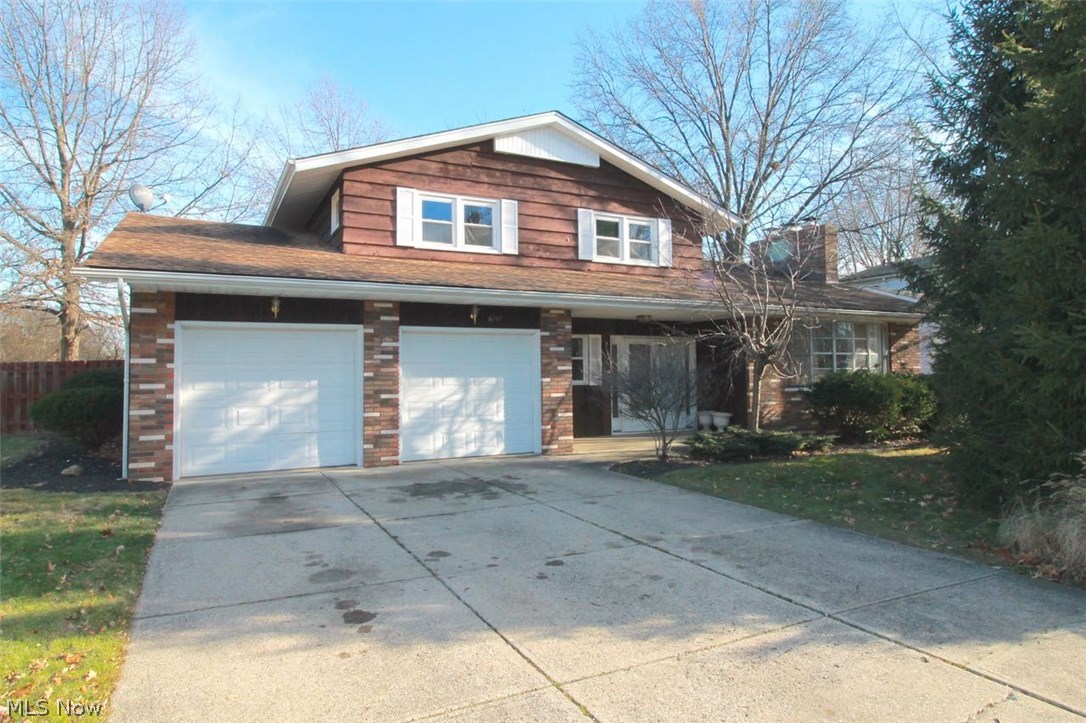 Welcome to this beautifully maintained four bedroom 3.5 bath split level home. Freshly painted with newer carpeting, electric  paneling, newer vanities in the second first floor bath and walk in showers; upstairs baths have been remodeled as well.  Newer light fixtures and toilets, first floor bath completely remodeled.  This home is the original model home, with an In Law Suite but that's not all, windows are vinyl double hung, recessed lighting and extra large sliding glass doors to name a few.  Spacious kitchen offers a countertop range, and a double oven for all your baking and cooking needs, lots of counter space along with cabinets for storage.  Spacious eating area off the kitchen which flows into the dining room and living room area with a cozy wood burning fireplace to enjoy on these cold winter days and nights.  First Floor Bedroom could also be used as an office with a private bath.  Great home for entertaining as well and a gorgeous yard complete this home. A patio in the b