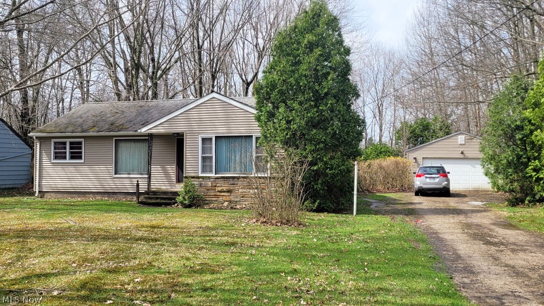 Great opportunity to renovate this Ranch style home to your specifications! / L-shaped living and dining rooms with kitchen access / Great layout / Fabulous yard and location / Detached 2-car garage / Will need your finishing touch!