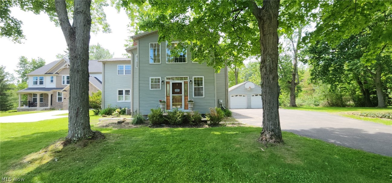 Welcome to 33430 Pettibone Rd, where timeless colonial charm meets modern updates on a rare 2-acre setting in the heart of highly sought-after Solon. Tucked away among beautiful wooded surroundings, this spacious 5-bedroom, 3.5-bath home offers over 2,000 square feet of inviting living space designed for both everyday comfort and entertaining.

Completely updated in 2013, the home blends classic character with thoughtful modern finishes. The recently renovated primary suite creates a true retreat, featuring a beautifully updated spa-like bathroom, while a brand-new roof installed in 2025 adds peace of mind for years to come. The basement was professionally waterproofed in 2020, adding even more value and confidence for the next owner.

A rare and valuable feature, this property includes two parcels totaling approximately 2 private acres, providing extra space, added privacy, and endless possibilities to enjoy outdoor living. Inside, you'll find an updated kitchen and baths, spacious room sizes, a cozy fireplace, and a walk-out basement filled with potential. The detached 2-car garage and expansive yard make this property perfect for gatherings, recreation, or simply enjoying the peaceful setting.

All of this is conveniently located near top-rated schools, shopping, dining, and highway access while still offering the privacy and tranquility that's hard to find in Solon. A truly rare opportunity to own acreage, space, and updates in one of Northeast Ohio's most desirable communities!