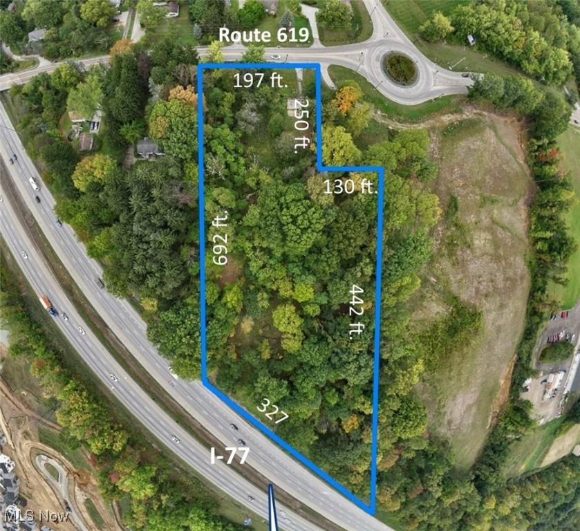 There will be a fourth leg of the Pickle circle with another access to property. This vacant lot is 3.68 acres and is commercially zoned General Industrial I-1. Additional 8.3 acres can be purchased that is bordering this property separately through a different seller - totalling 12 acres. Approximately 327 feet of frontage and visibility on I-77 and 197 feet of frontage on Route 619. Also borders small piece of land .66 acres owned by the City of Green (which they would be willing to sell). See city ordinances for complete list of allowed uses Section 157.085. Traffic count over 14,000 at Route 619 at Massillon Rd and over 112,000 Route 619 at I-77.