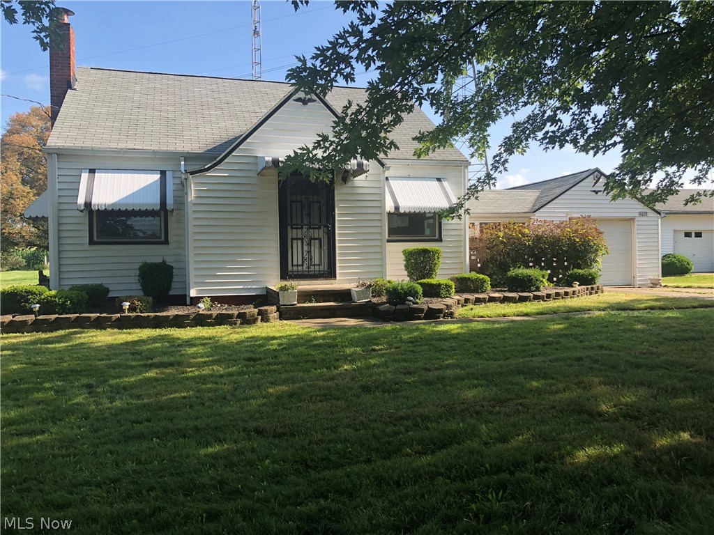 A car lover's dream! This country home offers a one car attached garage, one car detached garage, and a 5 car detached garage. Situated on little over an acre, this home can be restored to its former glory. Presence of mold. Sold as-is. Buyer to verify all information. Owner occupants only until 9/17. Equal opportunity housing.