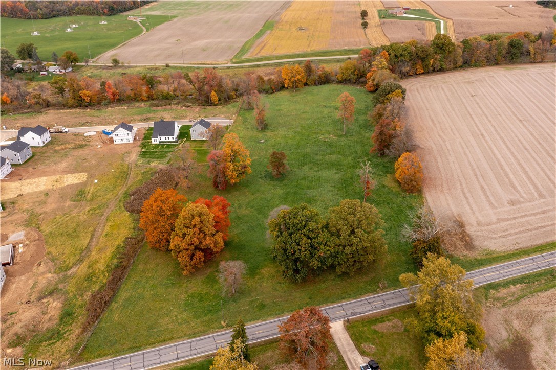 Exciting Real Estate Opportunity! 119-Acre Farm To Be Offered In 8 Parcels - Productive Cropland - Development Potential - Hobby Farm Parcels – 5-Bedroom Farmhouse - Inground Pool - Airstrip - Hangar - Bank Barn - Plain Twp. - Stark County - Plain Local School District - Online Bidding Available On The Real Estate - ABSOLUTE AUCTION, all sells to the highest bidders. ONLINE BIDDING BEGINS WEDNESDAY – DECEMBER 1, 2021 – 12:00 PM and AUCTION LIVE ON-SITE BIDDING WILL BEGIN SATURDAY - DECEMBER 4, 2021 - 10:30 AM, REAL ESTATE SELLS AT 12:00 PM. An ideal place to call home. Same owner for over 50 years! Better take a look! The property will be open for viewing on Saturday - November 27, 2021 – 2:00-4:00 PM. PARCEL #5: 7.3 acres with stately trees and creek. 350 ft. frontage. Parcels will be offered bidder’s choice through the multi-par system and parcels #1 through #4 will be offered as an entirety and will be sold the way it brings the most. Land is a good investment you can enjoy. Bank fi