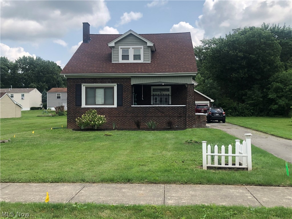 This beautiful all brick two story home is full of character sits on 3 city lots . Currently this home has been converted to a multi-family up and down duplex. First floor has large living-room with lovely fireplace, original woodwork and hardwood floors.  Kitchen features original farm house sink and all appliances. 2 large first floor bedrooms and updated bath.  Access to the full basement with laundry area. Upstairs unit features  large bedroom with huge closets for storage. Updated kitchen with all appliances and full bath.  Updates include newer roof, furnace and central air in 2020. Oversized 2 car detached garage.