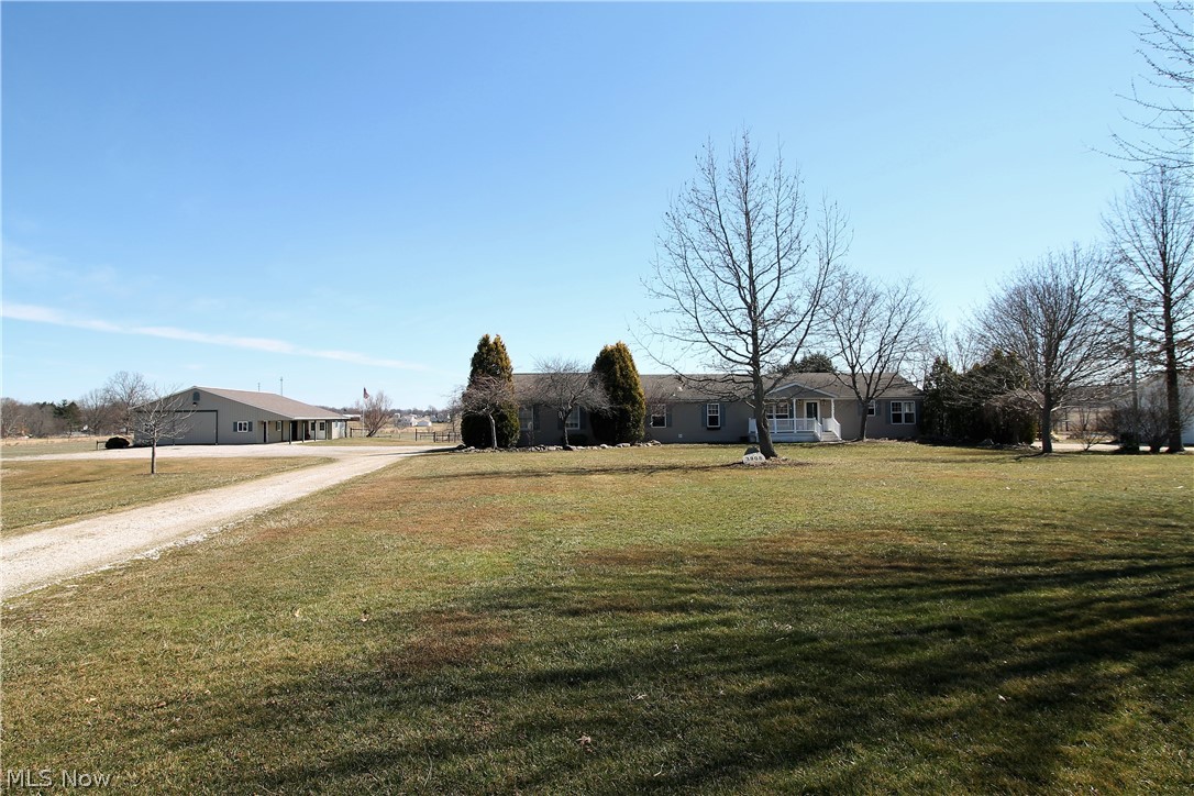 Welcome to this 3 bedroom, 3 full bath ranch home sitting on over 6 acres of tranquil beauty. New floors & lighting in this gorgeous open concept home. Family room is open to the kitchen & dining room. The bright, updated large kitchen has new cabinets, counters, farm sink, under cabinet lighting. Shiplap accent walls. Expanded eat in kitchen with new coffee bar. The dining room has a gas fireplace with stone backing. Luxury master suite offers His & Hers master baths(2020). His bath has new titled shower & tiled floor, all new vanity, counters, toilet, lights, wood accent wall, walk in closet & skylight. Her bath offers a soaking tub, new vanity, counters, toilet, sink, accent wall, new flooring, walk in closet. Countertop has built in bathroom appliance holders. Master suite has  new trim work, lighting, 2 point with reading nook. There are 2 more bedrooms & the laundry room with outside access is on the main level. Huge basement with tons of potential. Guest bath recently remodeled
