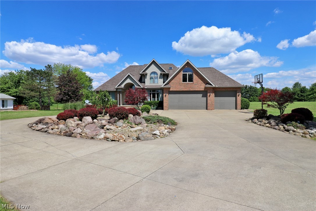 Beautiful home with new furnace (2019) and A/C (2017), 3 car garage with hot and cold water available and 32x32 pole building. Bonus Room above the garage makes a great play room or could be 4th bedroom. Two story entrance with cathedral ceilings. Large kitchen with spacious center island. First floor master bedroom and master bath, first floor laundry. Fantastic rec room/man cave in the basement. Gorgeous grounds with 2.5 acres and good sized back deck.