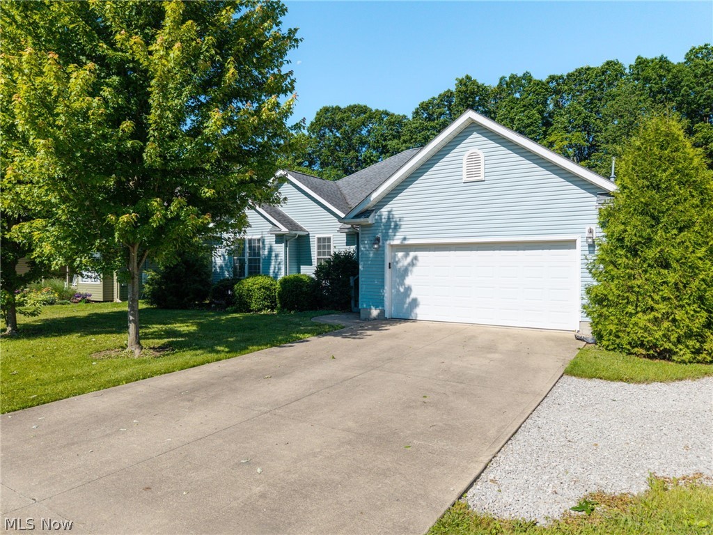 Welcome to this beautiful custom built open concept ranch located in the private gated community of Cinnamon Lake, nestled the heart of Ohio’s Amish Country. This move-in-ready home offers the perfect blend of comfort, style, and resort-style living. This home features 3 bedrooms and 2.5 baths, including two spacious primary suites, each with its own en-suite bathroom and walk-in closet, this home is designed for both everyday living and hosting guests. Step through the front door and be greeted by a newly remodeled kitchen and dining area, complemented by new LifeProof luxury vinyl plank flooring throughout. The vaulted great room features a cozy fireplace and French doors that open to a private deck overlooking the expansive backyard, offering plenty of space for relaxation and entertaining. 2 car garage with hookup for Tesla/electric car charger. The whole house water filtration system adds an extra benefit for the home. An additional lot next door is included, bringing the total property size to approximately 0.66 acres, providing exceptional outdoor space for recreation, gardening, or simply enjoying the peaceful surroundings. A storage shed offers added convenience. Enjoy all the amenities Cinnamon Lake has to offer, including a 135-acre private lake, beaches, fishing, marina, wet and dry docks, private lodge, swimming pool, tennis courts, pickleball courts, basketball courts, playgrounds, and more. Golf carts are permitted, making it easy to explore this vibrant gated lake community.Don’t miss this opportunity to own a move-in-ready home in one of Ohio’s premier private lake communities!