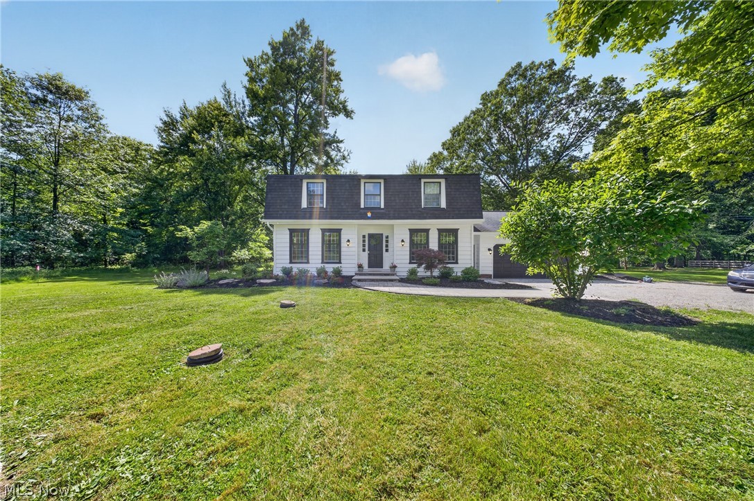 Tucked away on more than four acres in Hudson, this beautifully updated Colonial offers the perfect blend of privacy, natural beauty, and everyday comfort. Surrounded by mature trees, abundant wildlife, and a scenic pond, the property feels like a peaceful retreat while remaining conveniently located near all that Hudson has to offer.
For the past 32 years, this home has been the backdrop for countless memories. The expansive deck hosted family gatherings, paintball battles between the kids, and later, visits from the next generation. The sellers especially loved spending evenings outdoors listening to owls call through the trees, coyotes howl in the distance, and enjoying the peaceful sounds of nature. During the summer months, the woods fill in to create a private oasis where all you see is a canopy of trees and wildlife.
Inside, bright and inviting living spaces are filled with natural light and views of the surrounding landscape. The spacious living room and formal dining room provide welcoming gathering spaces, while the updated kitchen features stainless steel appliances, generous counter space, and a charming brick fireplace. The adjoining family room offers a second wood-burning fireplace and direct access to the deck overlooking the backyard. The flexible floor plan includes four bedrooms, including a convenient first-floor bedroom that can also serve as a guest room, office, or hobby space. Upstairs, the primary suite features hardwood flooring and a private bath.
Recent improvements include a new roof and attic vents (2026), interior and exterior paint, replacement windows, landscaping enhancements, rebuilt septic system, new garage floor, refreshed front walkway and steps, new carpet in sun room, and a newer deck.
Combining timeless Colonial charm, extensive updates, and over four acres of picturesque land, this is a rare opportunity to enjoy the peace, privacy, and lifestyle that make Hudson so special.