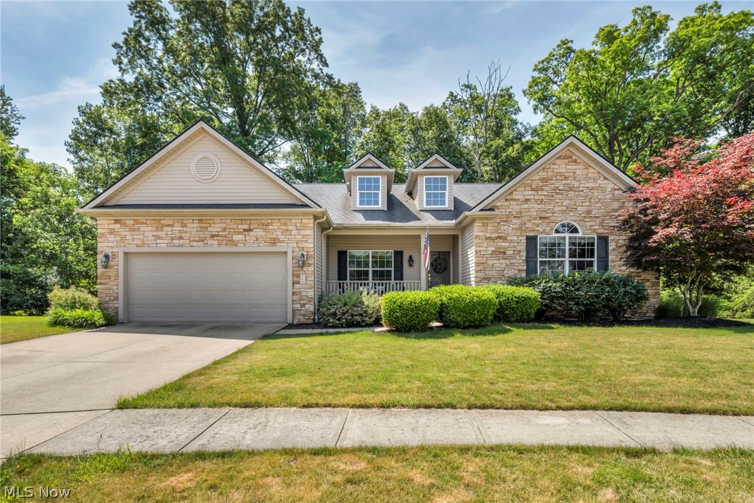 Welcome to 880 Shadow Creek Trail, a beautifully designed 3-bedroom, 3-bathroom single-family ranch home offering 2,276 square feet of comfortable, open-concept living space. The inviting main level features a spacious great room with vaulted ceilings, an attractive fireplace, and large windows that fill the home with natural light. The thoughtful layout flows seamlessly into a functional kitchen area and an attached sunroom, offering scenic views of the wooded lot and serene surroundings. The primary bedroom serves as a private retreat with its own dedicated ensuite bathroom. The expansive basement is a standout feature, complete with a theater room, a full bathroom, and two additional rooms that can easily be utilized as bedrooms. Outside, you can relax on the rear patio overlooking a deep, private backyard framed by mature trees, situated perfectly on a quiet cul-de-sac. Complete with a paved driveway and an attached two-car garage, this move-in-ready home is completely prepared for you to just unpack and enjoy.
