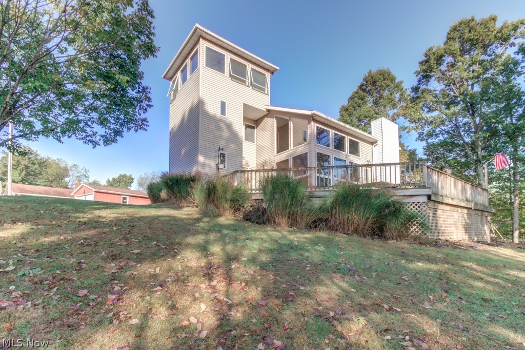 Wow!  The open floor plan with the two story high cathedral ceilings along with the panoramic lake views will amaze you.  The large deck now offers year around lake views.  This spacious home has three bedrooms and three full bathrooms.   The full basement has potential for an additional living space or is great for storage.  This is an ideal lake home, with its character and charm.  The "tower" can host a bedroom, living area or office space...lake views from almost every angle of this home.  This home has a flat, paved driveway.  Lake Mohawk is a 500 acre lake with unlimited horsepower, 3 beaches, 9 hole golf course, tennis courts and plenty of community events to enjoy.