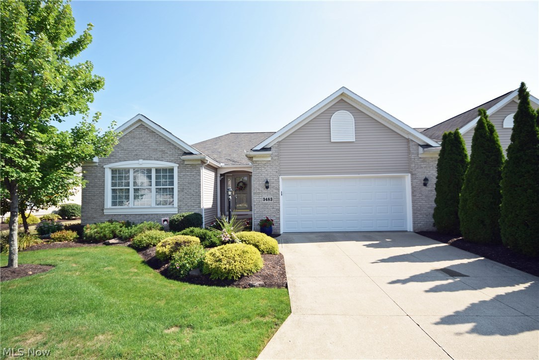 Well maintained like new custom-built cluster home on Mayfair Country Club 17th green! Beautifully well lit open floor plan! The large cherry kitchen featuring granite counter-tops, fully applianced with new stainless steel appliances, hardwood floors, vaulted ceiling with skylights and patio door off the dining room with great views of the golf course and water. A SunAir awning (electric) is included to shade the patio room on sunny days along with a natural gas hook-up for grilling. The great room features a gas log fireplace and vaulted ceiling with views of the golf course.   There is lots of natural light from the large windows and skylights.  The master bedroom offers a glamour bath including upgraded whirlpool tub and walk-in closet.  The third bedroom has french doors and is presently used as an office. Each room has a ceiling fan, custom blinds and window treatments and double paned storm windows throughout.  There is a full yard sprinkler system included to water the fully la