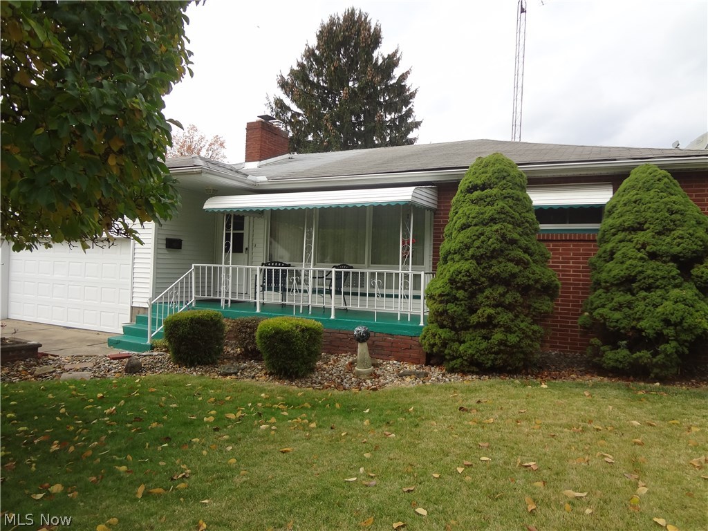 Lovely updated three bedroom, bath and a half ranch on a cul de sac is where you'll find this well maintained home. Vinyl and brick sided with a covered front porch to welcome you. The large living room has a wood burning fireplace. An updated kitchen with all the appliances and an eating area, ceramic flooring and a man door leading to the private backyard with a wooden deck with a retractable awning and patio area and partial chain link fencing. The full basement has glass block windows for an extra sense of security. The double attached, heated garage gives you easy access to the house. Don't miss your chance to own this lovely ranch home in Howland Schools District.