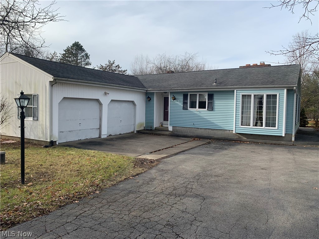 Great location! Quiet, peaceful, country setting just minutes to everywhere. Large corner lot. 2 bedroom, 2 bath ranch home with a 1st floor utility room. Kitchen has an eating area and a formal dining room, living room with fireplace and built-ins, 2 car attached garage, and partial basement. Home warranty provided!