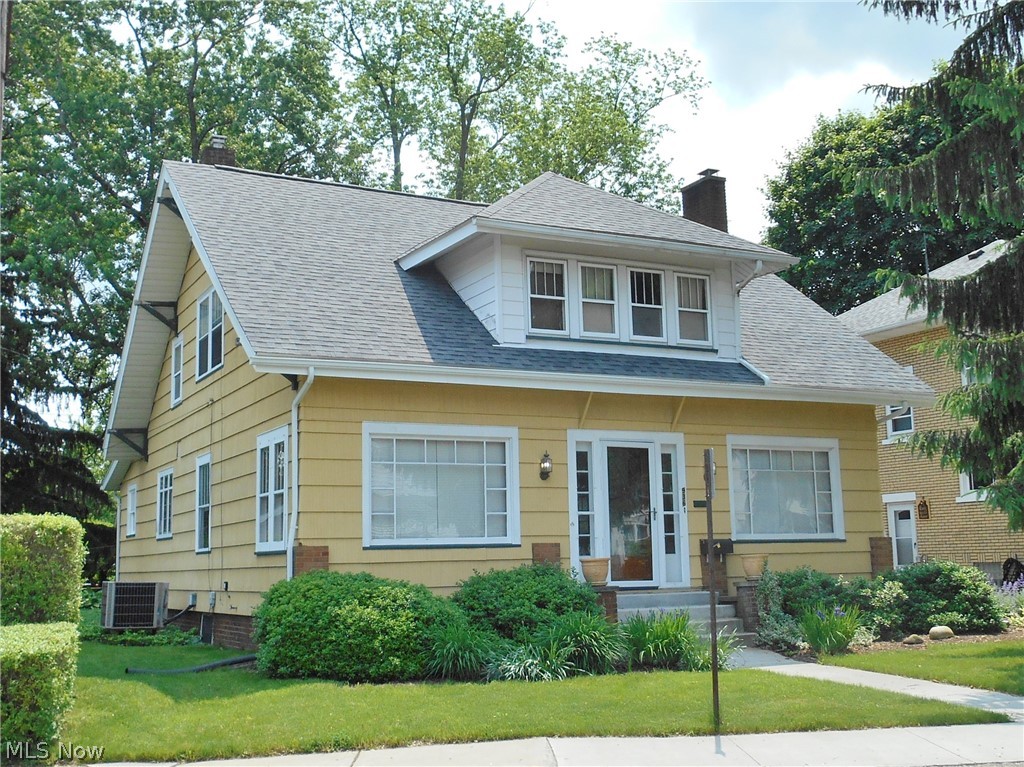 This move in ready well maintained Craftsman home in a park like setting with a 2 stall detached garage and a shared new concrete driveway. Convenient North East Massillon location close to park and shopping is ready for new owners.  The first floor has a large eat in kitchen with a walk in pantry, formal dining room with beautiful coffered ceiling, living room with fireplace  and built in bookcases, additional 12X12 TV room plus the 4 season front porch with a half bath complete the first floor. The second floor has 3 bedrooms with large closets and a full bath. The lower level is partially finished with a half bath and plenty of storage. The roof was new  in 2018 and every room has fresh neutral paint.  America's Preferred Home Warranty is included for your peace of mind.