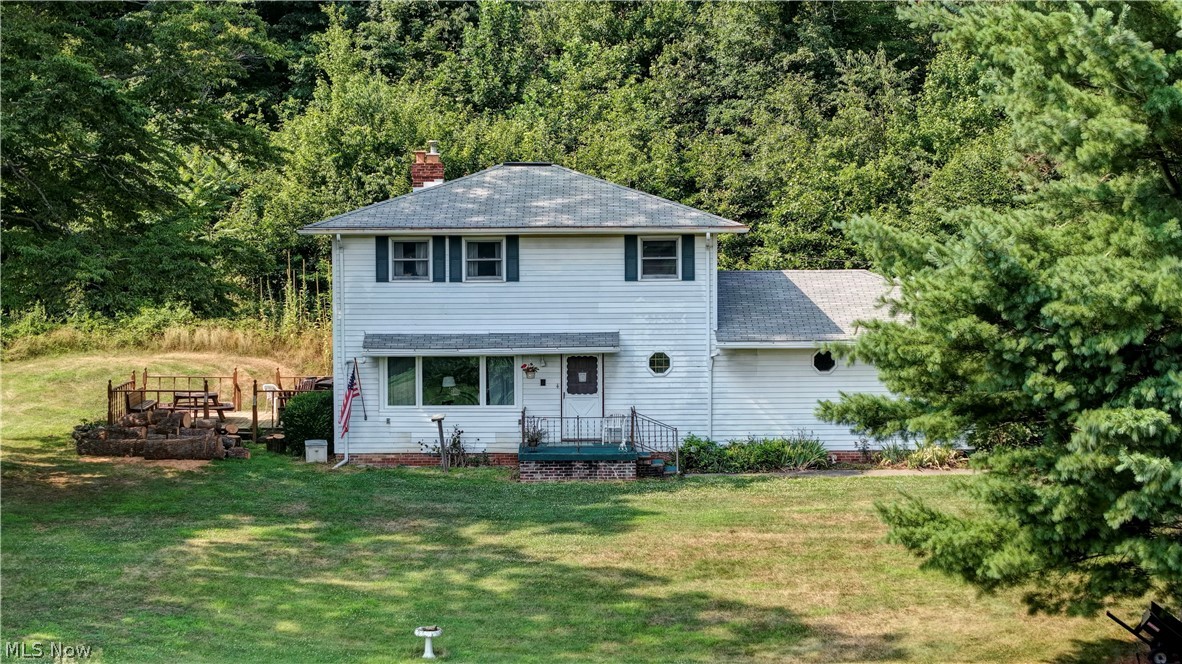 Looking for privacy and room to roam? This 3-bedroom, 1.5-bath home is tucked away at the end of a dead-end road, offering the perfect blend of peaceful country living with open space and wooded surroundings. Situated on 4 scenic acres, the property features an open front yard and a wooded backyard, providing plenty of room to enjoy nature. Inside, you’ll find a spacious living room with a cozy wood-burning fireplace, a home office, and a kitchen with an eat-in dining area that walks out to the back deck. The main level also offers a convenient laundry room and half bath. Upstairs are three bedrooms and a full bath, while the full basement provides endless potential to finish for additional living space. Whether you’re looking for peaceful views, room for outdoor activities, or a home you can make your own, this property is full of possibilities!