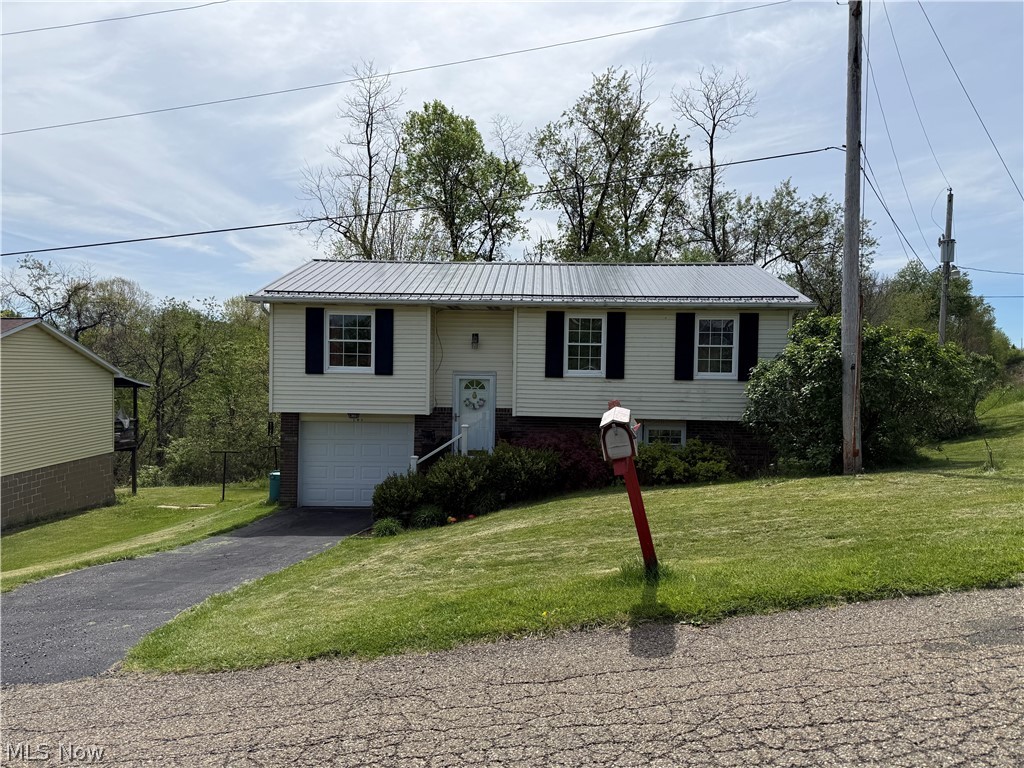 Welcome to this beautifully updated split-level home featuring a brand new roof (April 2026) and a new deck ( April 2026) —perfect for outdoor entertaining and offering peace of mind for years to come.
This home offers 3 bedrooms with the potential for a 4th bedroom, providing flexibility for a home office, guest space, or growing household. step inside to a stylish, move-in ready interior that blends modern updates with everyday comfort. The updated kitchen is a standout, showcasing sleek white cabinetry, stainless steel appliances, a farmhouse sink, and a striking tile backsplash that adds both texture and character.  The fully remodeled bathroom features contemporary finishes, a glass-enclosed shower, and a clean, modern design. The inviting living area is filled with natural light and complemented by warm flooring and a functional layout, creating a comfortable and open feel. Neutral tones throughout make it easy for any buyer to personalize the space.