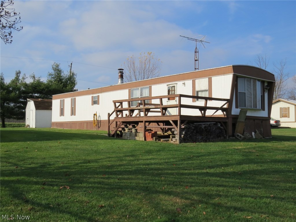 2 Bedroom Mobile Home with 32'x32' Garage! Level, country lot located near public hunting area. Mobile home needs some updating. Large garage with shed addition and storage shed also. Handy location to Carrollton and Canton. Annual taxes without Homestead Reduction and including mobile are $ 327.54      per yr. All minerals owned transfer with property. Property is subject to current gas and oil lease.