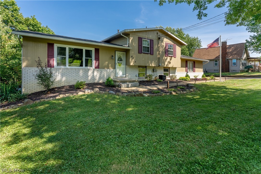 Beautifully updated split-level in Perry LSD on over 1 acre of land.  The main level is large and open and features a great room, dining room, and eat-in kitchen with updated flooring, white trim, neutral colors and lots of natural light.  The kitchen has new stainless steel appliances with tile back splash and plenty of counter top and cabinet space.  Up a few stairs is a renovated bathroom with a crisp, clean new vanity,  and shower/tub combo with gray tile surround.  The master bedroom is generously sized with access to the bathroom and soft, plush updated carpet (highest grade memory foam padding).  Two additional bedrooms are spacious with new flooring and paint throughout.  On the lower level there is an additional full bathroom with stand up shower, updated light fixtures, ceramic tile and two cabinets for additional storage space. The rec room has ceramic tile floors, bar with sink and stools (that stay) and plenty of additional space for entertaining.  Through the sliding glass door you will find your backyard oasis with a deck, hot tub, above ground pool, and partially fenced in backyard.  That's right, this yard goes BEYOND the fenced in area and extends right before the two poles in the far back!  Want to see for yourself?  Book a showing today or come to the open house on Saturday, July 30th from 2:00PM-3:30PM.
Additional updates include new thermostat; New deck railing, cement pad and hot tub hook up; brand new pool liner;