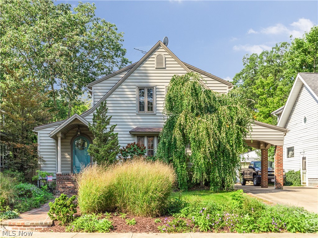 A brick walkway leads to this phenominal Cuyahoga Falls Colonial that features over 1600 square feet of incredible living.  With hints of the past meshed with a flowing open floor plan, this home combines the best of the old and the new. The spacious living room is accented with rich wood molding and a 5 panel window that maintains the homes charm. The impressive kitchen boasts red oak cabinetry with convenient pull outs + a huge island with plenty of room for seating. The kitchen is open to the family room area, where you are surrounded by glass sliding doors that bring the outdoors to you while eating or relaxing.  The formal dining room exits to a fabulous sun room.  Outside decking can be accessed from the kitchen, family room and sun room allowing for the most perfect entertainment opportunities. Three nicely sized bedrooms and a full bath with a vaulted ceiling and  jacuzzi tub complete the second floor of the home. Vinyl siding, newer two car garage and a car port with brick col