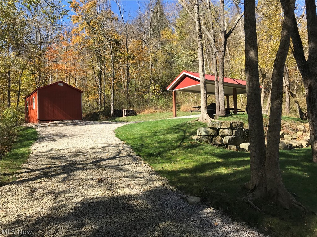 A hunter's or nature enthusiast's dream.  Here are 125 acres of prime hunting land in Athens Co. Many mature deer & turkey have been taken from this property.  Easily explore the entire property by way of old logging roads that make great hiking or four wheeler trails.  The back side of the property has a beautiful cave that has an occasional waterfall.  A gravel driveway makes easy access to the entrance of the gated property where you'll find a garage with a bunk as well as a picnic area.  I've walked this entire property, there are a few areas that would make great home sites or excellent hunting cabins.  Along with the 104 acres of wooded area, across the road is 21 acres of tillable field with access to the Hocking River.  Build a dream house by the river, farm & fish the river banks or develop the land into campsites.  The possibilities are endless. Mineral Rights Convey to new owners!!!