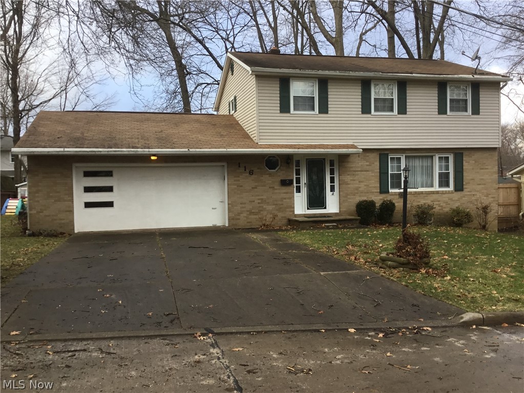 Fantastic opportunity to find the 4 bedroom home you've been searching for in the Mogadore School District! This spacious Colonial has all the features on your list! Four bedrooms, 1 and 1/2 baths, partially finished walk out basement, heated, attached 2 car garage, front porch, rear patio, shed and much more! Foyer entry with coat closet and ceramic tile flooring leads to the unbelievable kitchen! Boasting all new hardwood cabinetry, granite counters with breakfast bar, 4 piece new stainless appliances plus plenty of storage, prep and gathering space! It is open to the dining room which flows effortlessly into the large living room with a nice large picture window. Upstairs are 4 generous bedrooms and a freshly painted full bath with a double vanity and tub/shower combo. There is also easy access to storage. The walkout basement has additional closet/storage space in the huge rec room to keep gaming, craft and hobby materials organized! Attached 2 car heated garage boasts a work bench