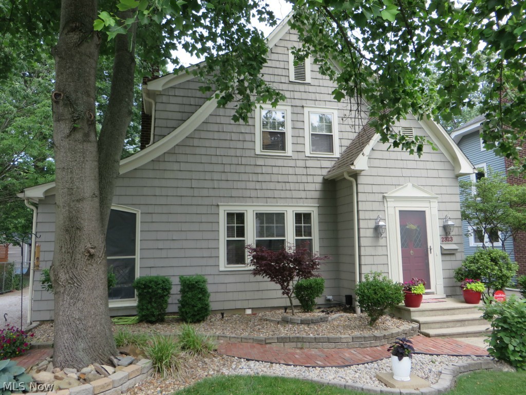 Absolutely charming Tudor home in very desirable area of Cuyahoga Falls.  Stunning landscaping w/great open deck.  True 2+ car garage and chain link fence around the back yard.  You will love the sun room off the living room and the gas fireplace in the living room.  Glass tiles in kitchen and 1/2 bath.  Totally water proofed, new electric panel.  Well done home with beautiful touches in every room.