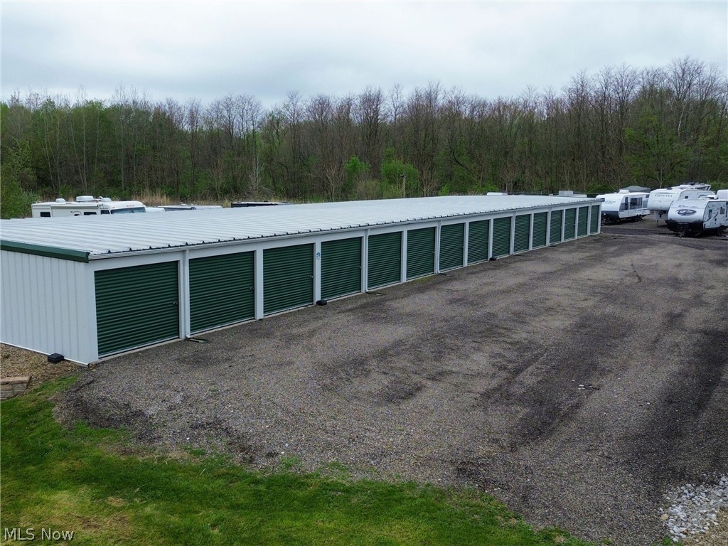 Auction on-site and online Thursday, June 11th. Bidding Starts at 5:00PM EST. Open house Tuesday, June 2nd from 4:00PM to 7:00PM EST. This well-maintained self-storage facility offers 122 total units with a strong, functional mix, including 2 (10x10), 40 (10x15), 26 (10x20), and 2 (10x30) units, along with 52 35x12 outdoor parking spaces ideal for boat, RV, and vehicle storage. The diverse unit mix supports multiple revenue streams and consistent demand, contributing to the property’s strong in-place income.
The facility is fully secured with gated access, surveillance cameras, and on-site lighting, providing both tenant security and operational efficiency. Well maintained with minimal immediate capital needs, this asset offers stable cash flow with upside through rental increases and occupancy optimization. Located in Rittman, the property benefits from a key competitive advantage, as the city currently has a moratorium restricting new self-storage development. This barrier to entry helps limit future competition and supports long-term occupancy and rent growth, making it an attractive investment opportunity.