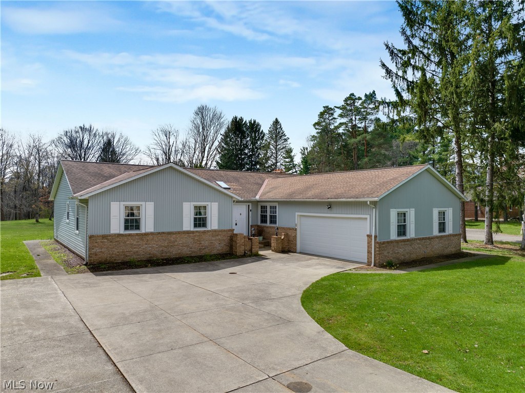 Welcome to this beautifully maintained brick and vinyl ranch offering over 2,200 sq. ft. of comfortable living space, plus a full partially finished basement! This home features a newer roof and skylights, filling the space with natural light. The enormous kitchen with a spacious eating area flows seamlessly into the inviting family room, complete with a cozy gas fireplace—perfect for everyday living and entertaining. A sliding door leads to an oversized deck overlooking the stunning lot. Throughout the home, you’ll find quality touches like solid interior doors and generous room sizes. The oversized 2.5-car garage provides ample space for vehicles, storage, or hobbies. The spacious master bedroom includes an updated full bath for added comfort and convenience. Downstairs, the finished rec room offers additional living space ideal for a media room, home gym, or play area. Set on a gorgeous 1.26-acre property, this home combines space, functionality, and charm—don’t miss your opportunity to make it yours!
