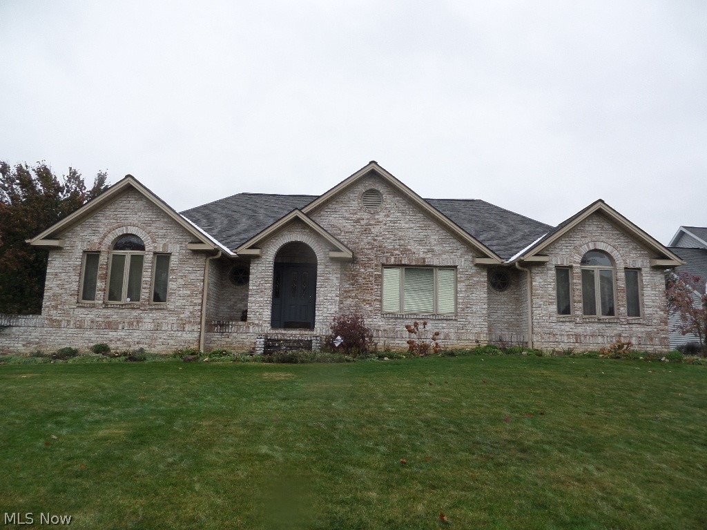 Outstanding quality in this custom-built brick ranch in Girard area of lovely homes.  Solid 6 panel doors and gorgeous woodwork throughout.  Pella designer windows with built-in mini blinds. Welcome guests in the spacious foyer.  New owners will enjoy cooking and entertaining in this huge kitchen with handmade cabinets and plenty eating space.  Additionally, formal dining room and elegant vaulted great room. Front sitting room could be bright, lovely office.   Lots of windows in the Florida room overlooking the back yard.    Large laundry room with plenty of cabinets for storage.  Jack-and-Jill elegant bath adjoining the 2 bedrooms on the first floor.  Second full bath in basement abutting possible third bedroom.  Patio and rear-entry garage.    The builder outdid himself on solid luxury in this home.  Call Bernice and Dom for your private showing.