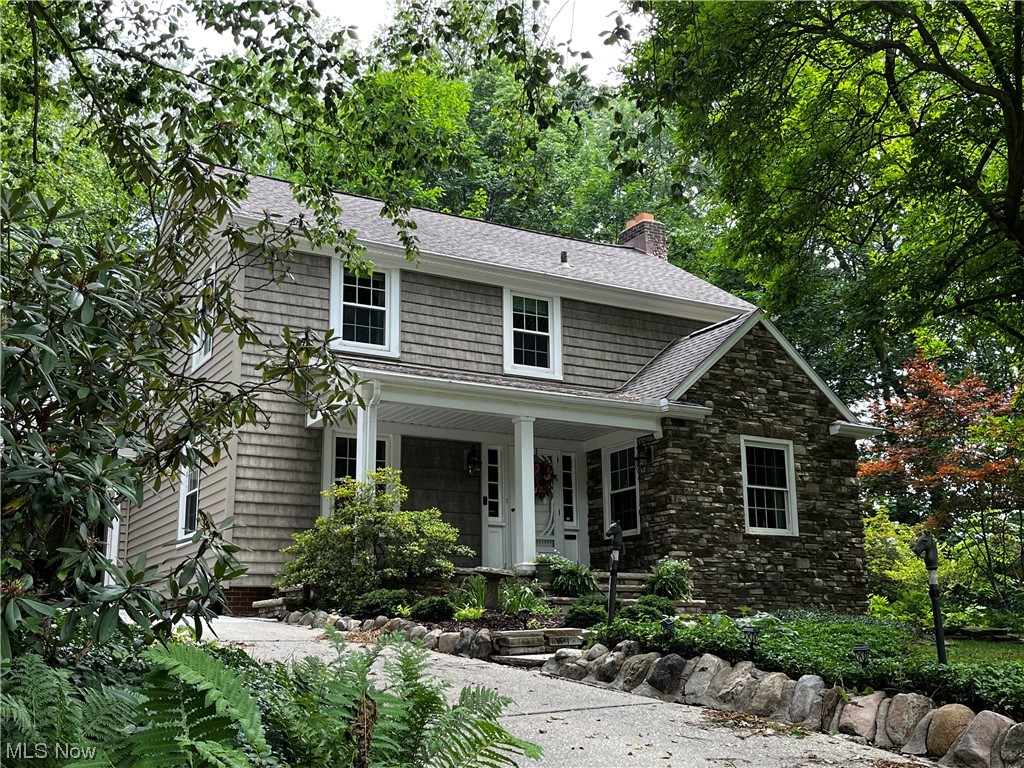Welcome!  You will fall in love with the quiet cul de sac location and the winding driveway that leads to this beautiful Home.  The charm and character will surround you as you enter the foyer with marble flooring. The center hall opens to the living room on the right and dining room to the left, both with gleaming hardwood floors that flow throughout home.  The family room, with woodburning fireplace and  bow window, gives you the first glance of the 2 tier stone patio and the private yard complete with winding brick walkway and arched bridge. The dining room opens to the custom designed kitchen with Amish built cabinetry.  Beautful granite counter tops enhance the stainless steel appliances and the spacious Island. There are 2 pantries and a built in bar that opens to the patio. Thoughtfully designed with convenience for families, entertaining, morning coffee or a quiet evening. A half bath, too. The second floor offers a spacious master bedroom, 3 additional bedrooms, one with a woo