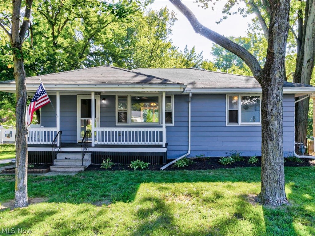 Move right into this 2 bed, 1-1/2 bath ranch with many features including hardwood floors, a front porch and a walk-out basement on a corner lot. Newly painted inside and out! The kitchen offers a great deal of storage and counter space and the sliding glass doors in the dining room provide natural light and direct access to the massive back deck (53 x 12). Enjoy extra storage and extra living space in the partially finished basement and the backyard is perfect for relaxing or entertaining.