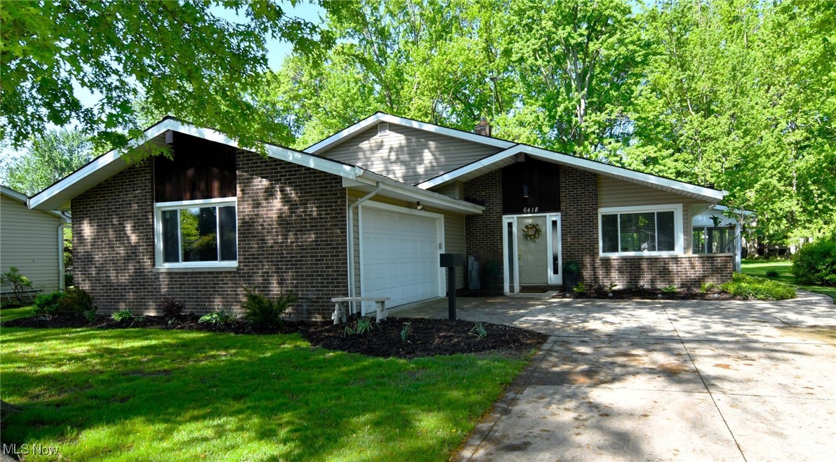 Absolutely beautiful 3 bed/1.5 bath vaulted split home featuring a gorgeous sunroom and deck situated on a lovely park-like lot. This home will "MOVE YOU." Nearly everything has been replaced or upgraded, including the stunning white kitchen with quartz counters, all brand-new stainless appliances, luxury vinyl flooring, and fixtures. The entire home has been freshly painted. A trendy wood plank accent wall has been installed, complete with an electric wall fireplace. The first floor showcases all new windows, including a slider to the modern sunroom with a retro freestanding fireplace. Both bathrooms have been gutted and remodeled. The family room features new carpet, paint, and recessed lighting. There is a special bonus room ideal for crafting, exercise, or use as a workshop. All bedrooms boast fresh paint and carpet, with hardwood floors beneath the carpet in two rooms. The furnace and air conditioning unit are less than 2 years old. Outside, you will find a beautiful deck and storage shed, all situated on a very nice treed lot that offers privacy. Open house Sunday from 2-4.
