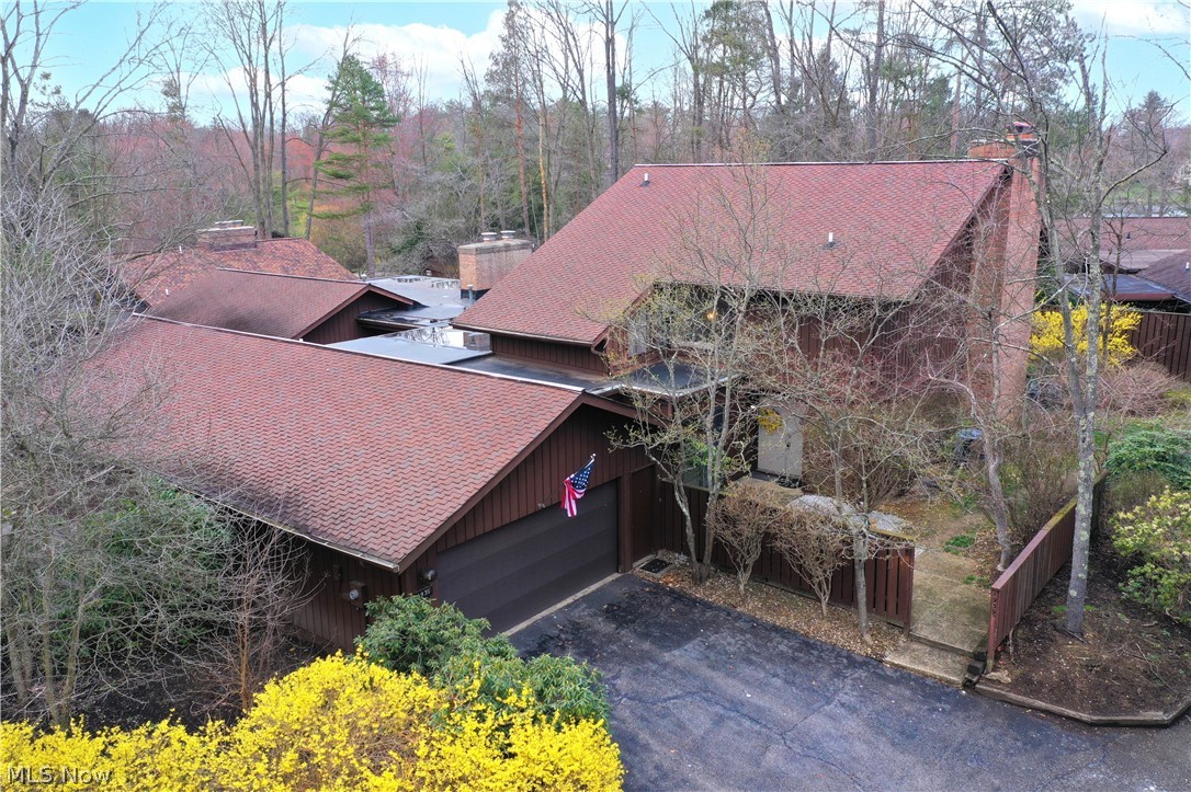 Welcome to this fantastic 3-bedroom, 2.5-bathroom condo nestled in the heart of The Pines, offering a blend of comfort and natural beauty in Kent! Upon entering, you are greeted by a spacious living area flooded with an abundance of natural light. The floor plan seamlessly connects the living room to the dining area and kitchen, creating an inviting space for relaxation and entertainment.  Adjacent to the kitchen, sliding glass doors lead out to a charming patio, perfect for enjoying morning coffee. The nicely sized living room is complete with a wood burning fireplace and two large sliding glass doors to an oversized patio, perfect for entertaining. The master bedroom has impressive vaulted ceilings, access to a deck over looking the patio, and wood burning fireplace and is complete with an ensuite bathroom. The two additional bedrooms are generously sized with one having access to a  private balcony to enjoy peaceful escape. This condo offers the perfect blend of convenience and suburban tranquility, making it an ideal place to call home. Call today for your showing!!