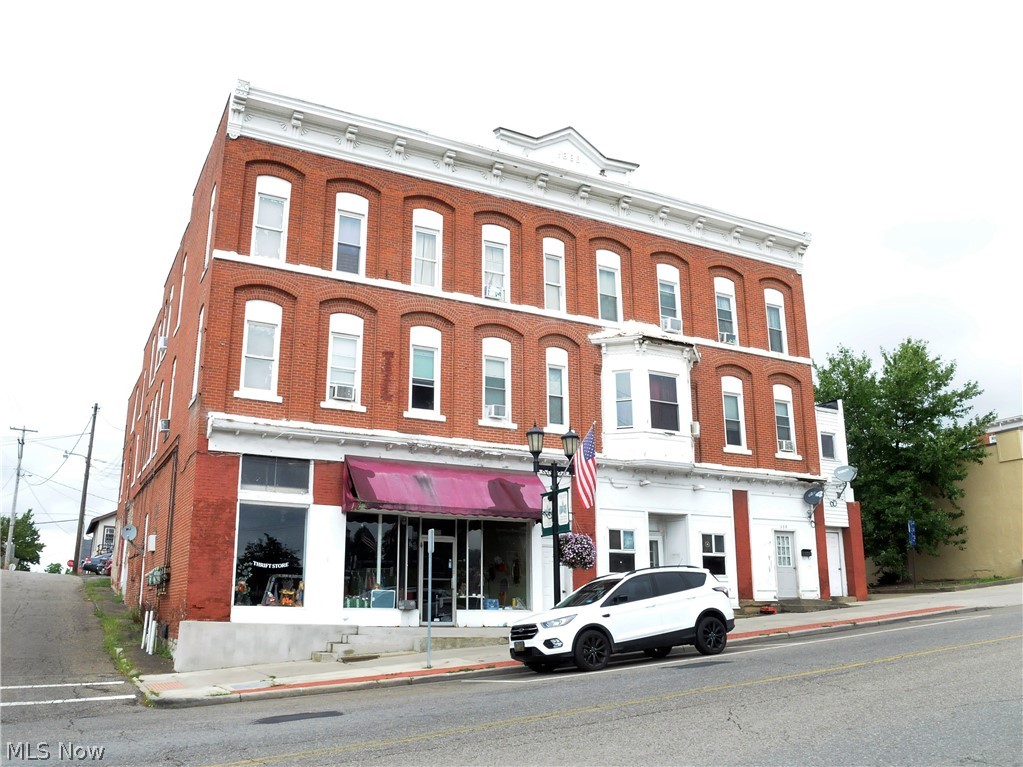 Great Investment Opportunity, Commercial building in Historical Downtown Cambridge.  Main level houses 3000 sq ft retail space bringing 800.00 monthly income; with six units of residential rentals combined bringing $4609.00 income.  All units are occupied with long term tenants.  Updates to rental units include new heating 2012, new drywall, updated kitchens and bathrooms 2017 to include new hot water tanks, electrical updated 2017, all units have updated carpets and linoleum flooring.  Four of the units are HUD certified. Also included three bedroom house, all units have access to off street parking.
